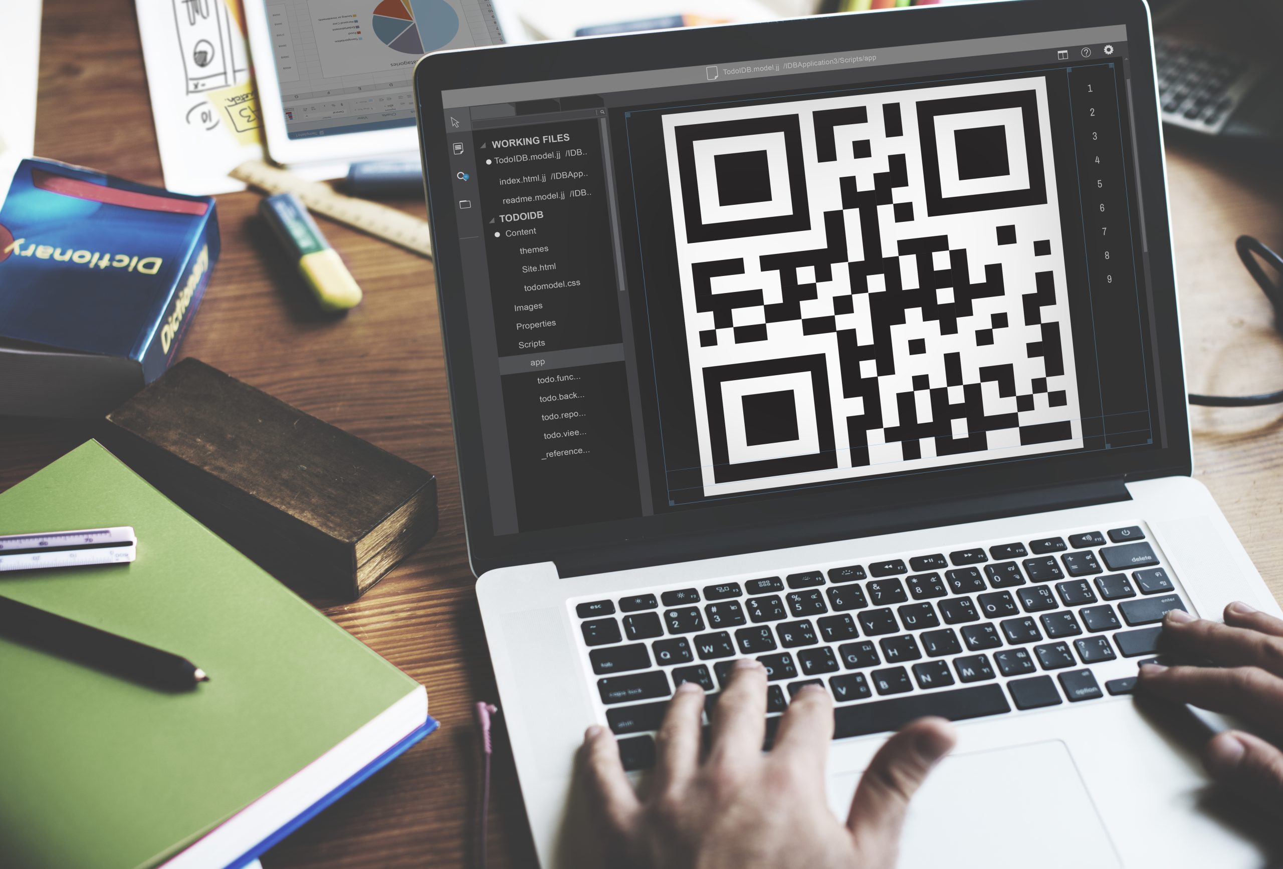 Closeup of notebook screen showing qr code