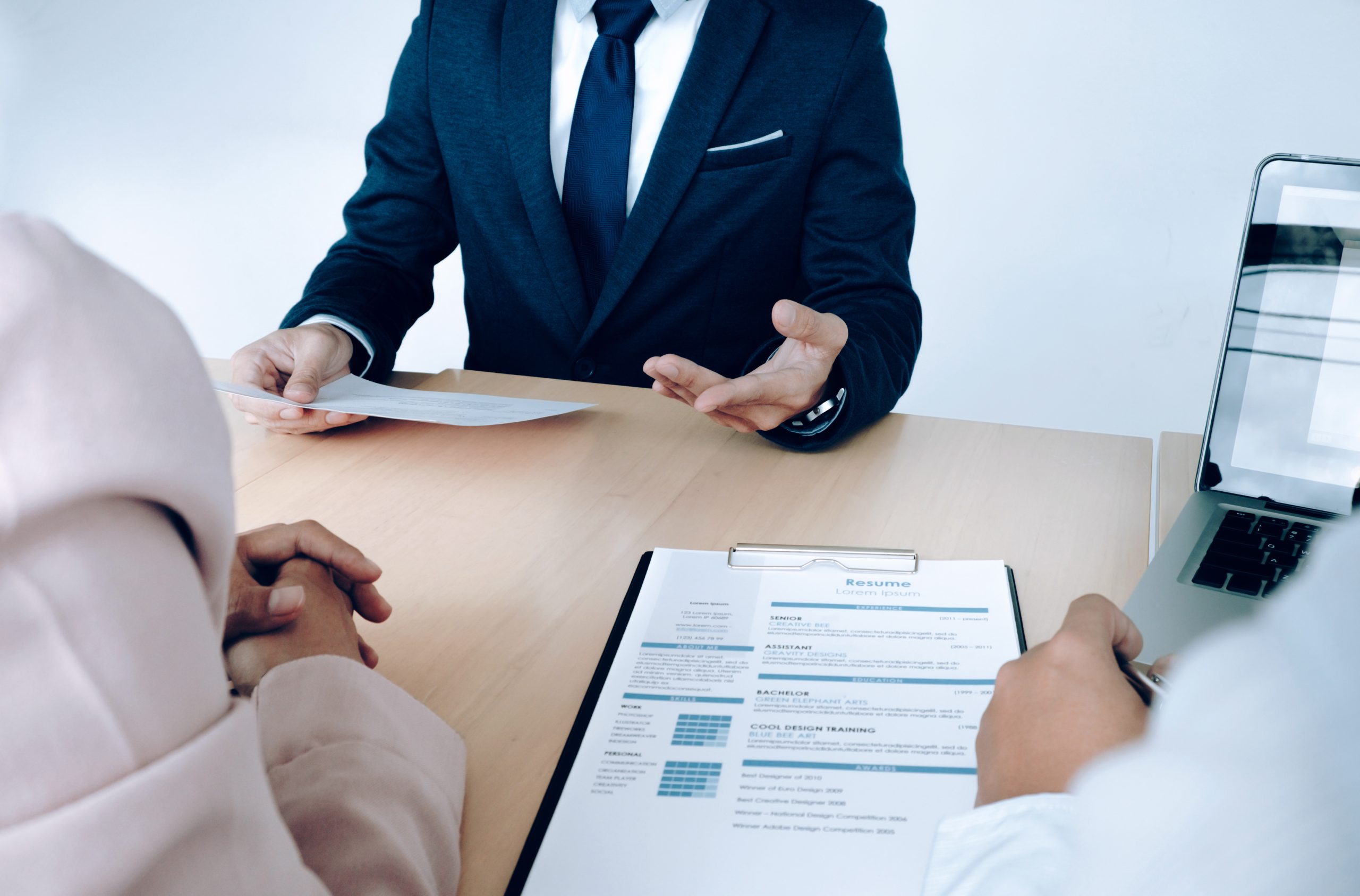 Business situation, job interview concept. Job seeker present re Business situation, job interview concept. Job seeker present resume to managers.
