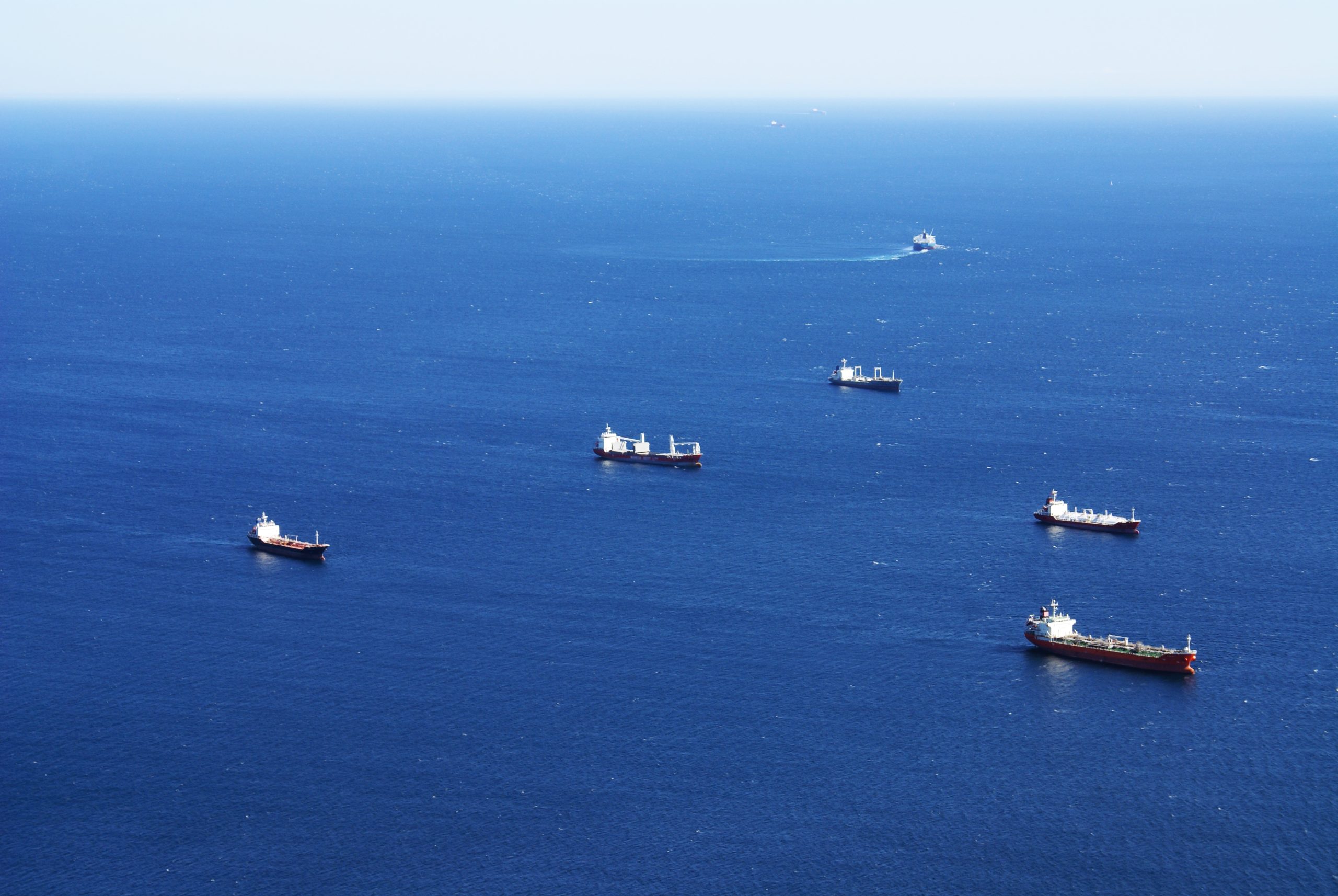 A high angle shot of ships sailing in the sea in Gibraltar